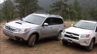 2011 Toyota RAV4 vs Subaru Forester muddy mashup review [upl. by Uttica954]